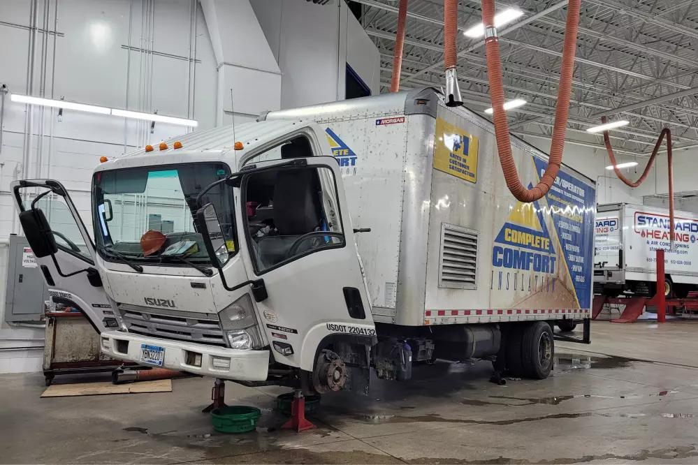 A truck is being serviced and repaired